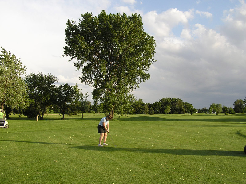 Woman playing golf at Fair Play Golf Course